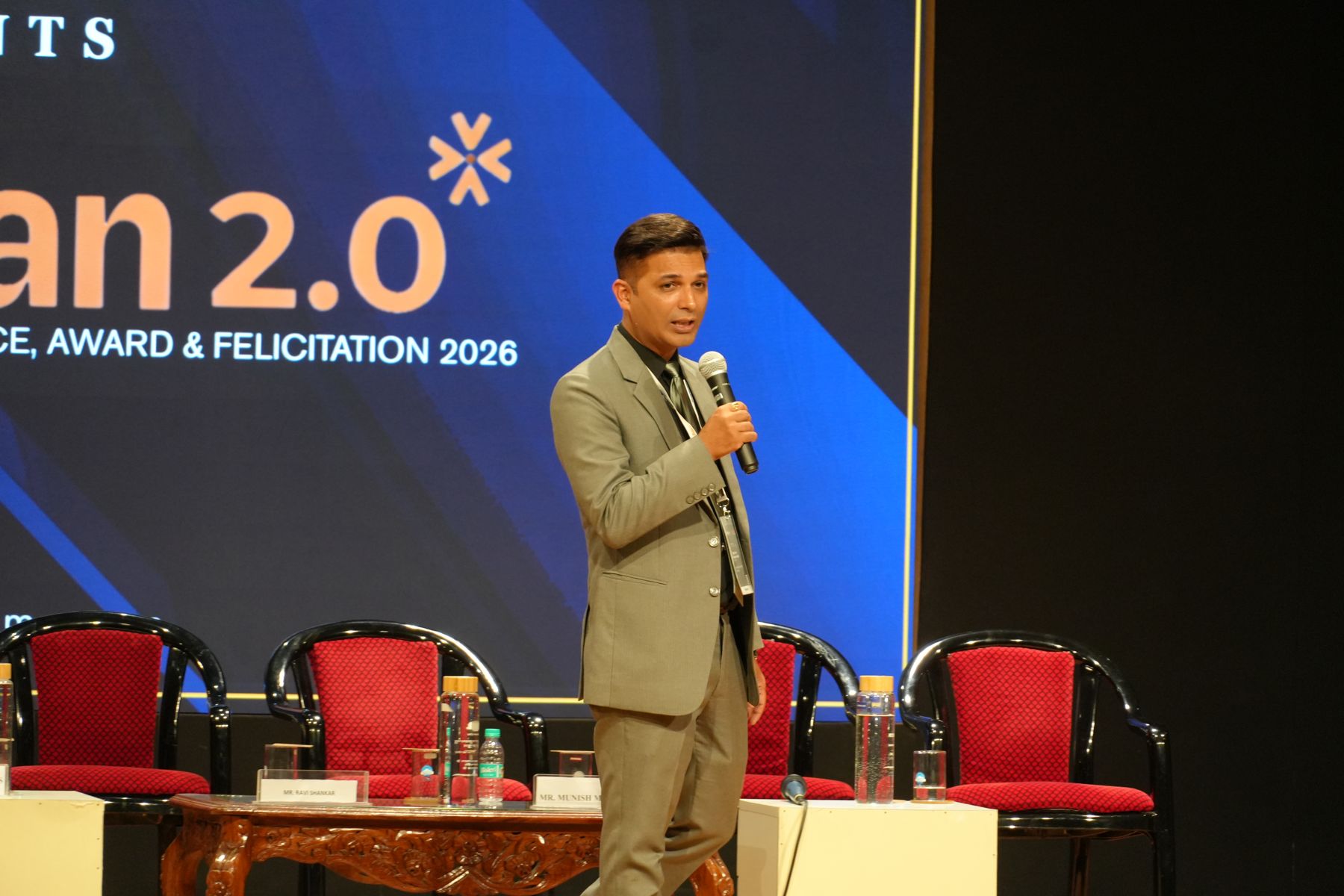 The organiser addressing the audience on stage at Aarohan 2.0