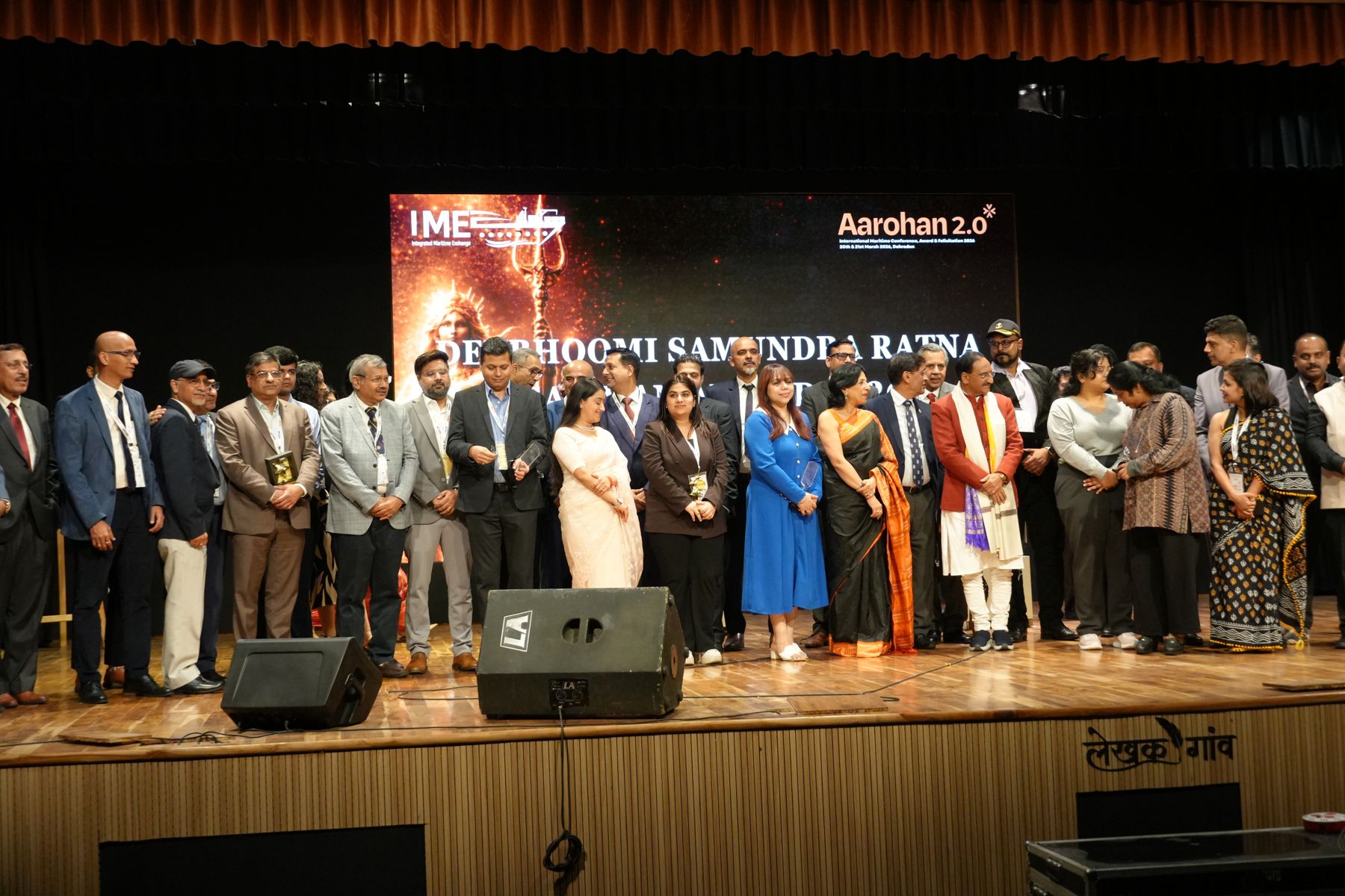Award recipients, guests and organisers together on stage after the ceremony